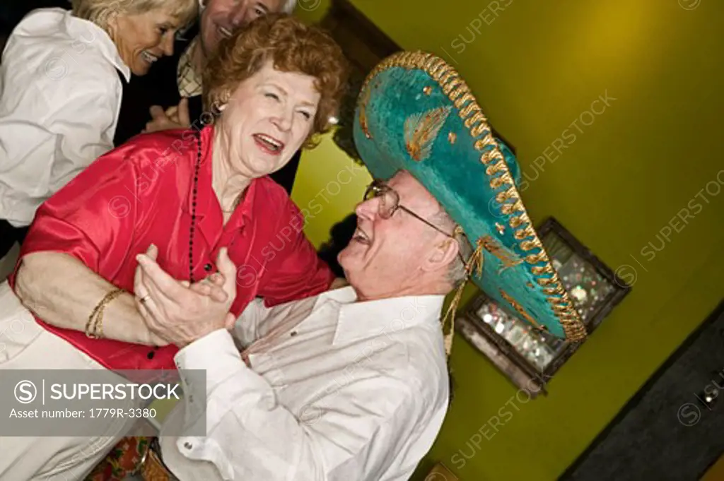 Senior couples dancing at a party