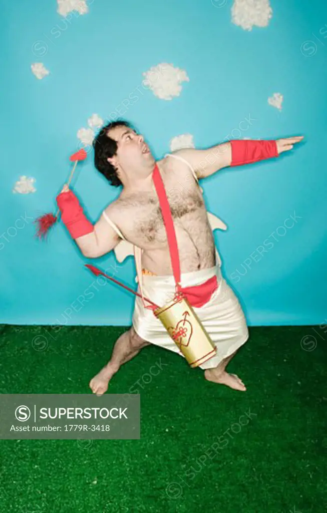 Man in Cupid costume throwing arrow