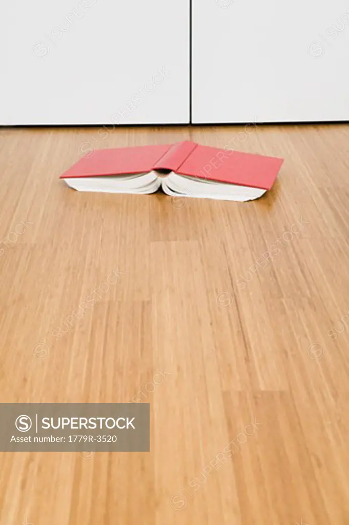 Book laying open on floor