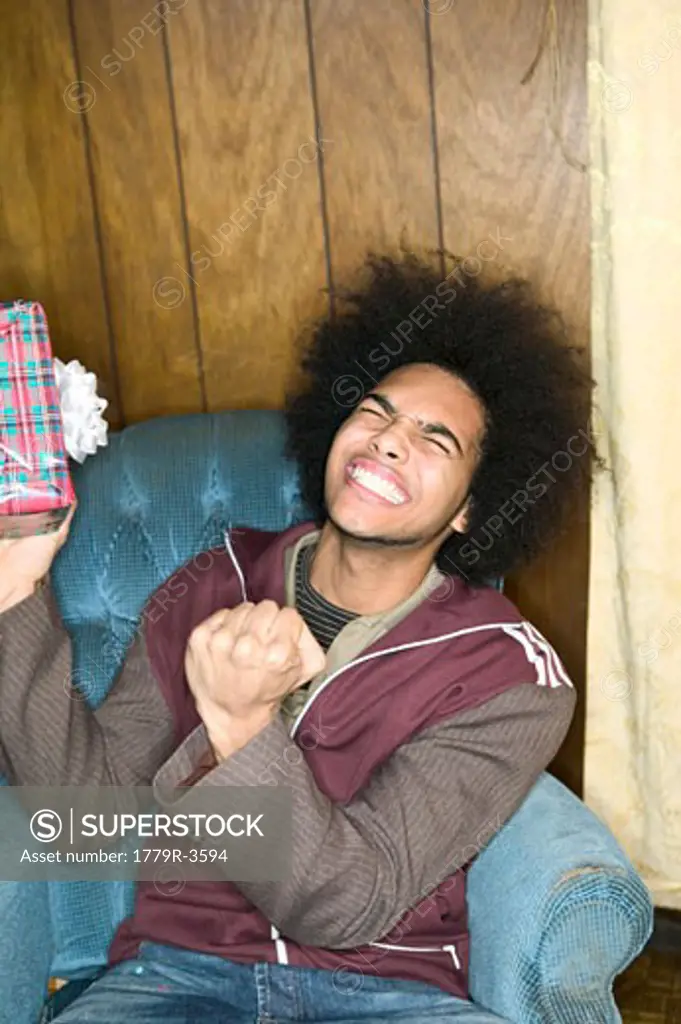 African man excited about receiving a gift