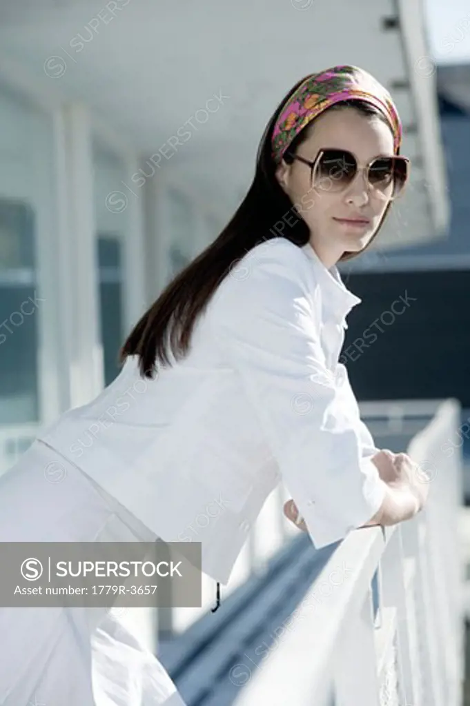 Woman leaning on railing