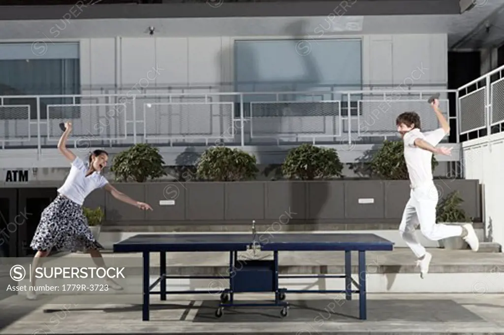 Couple playing ping-pong