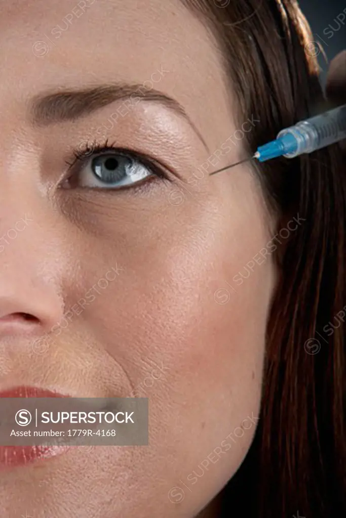 Young woman having Botox injection