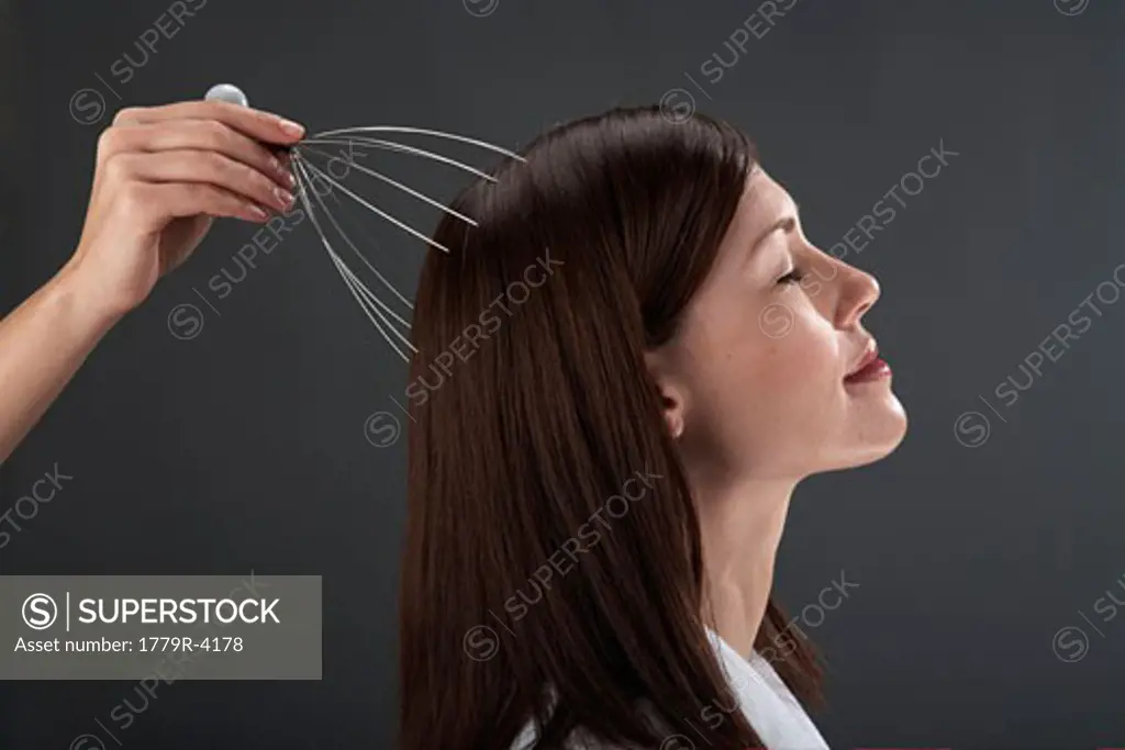 Young woman getting scalp massage