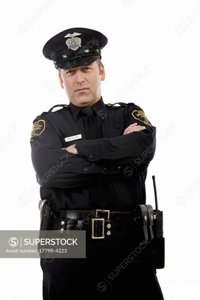Male police officer with crossed arms