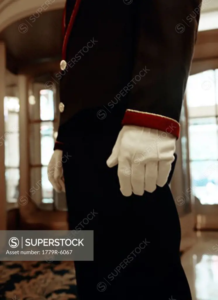 Side view of man wearing white gloves