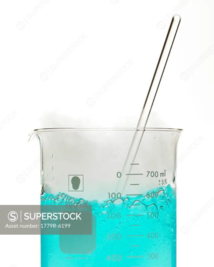 Bubbly blue liquid in beaker