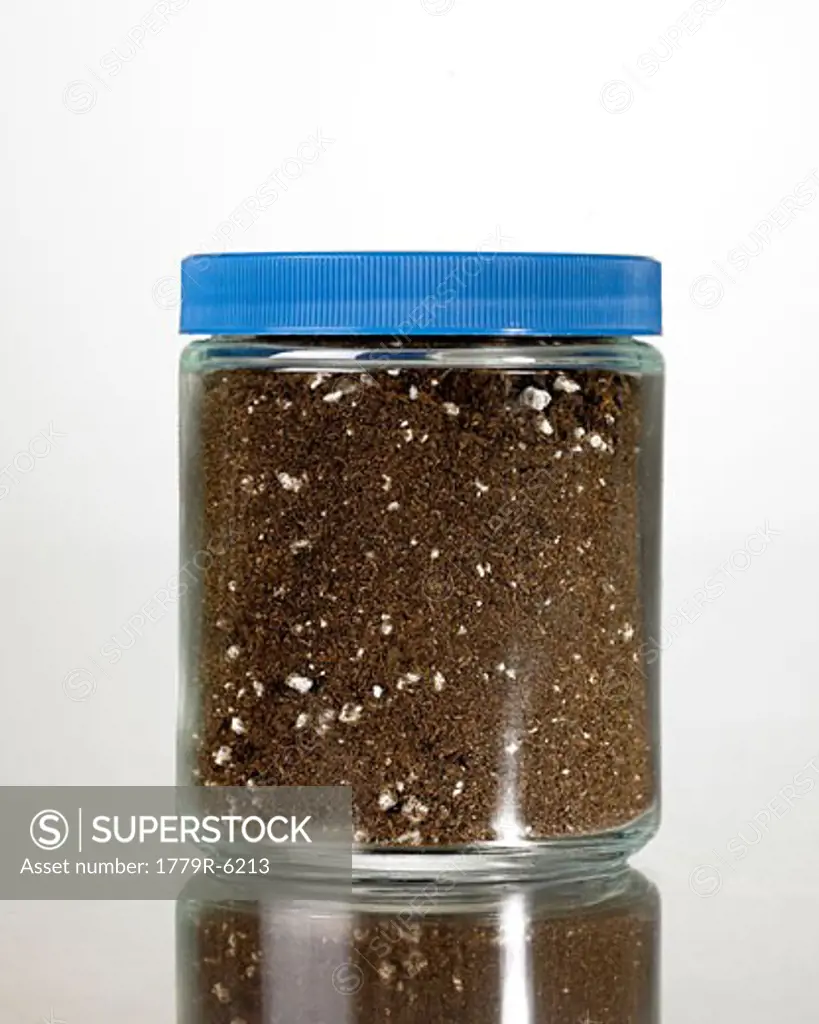 Dirt in glass container