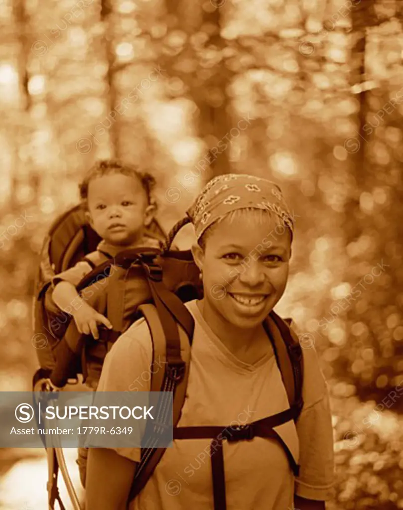 Woman hiking with baby in backpack