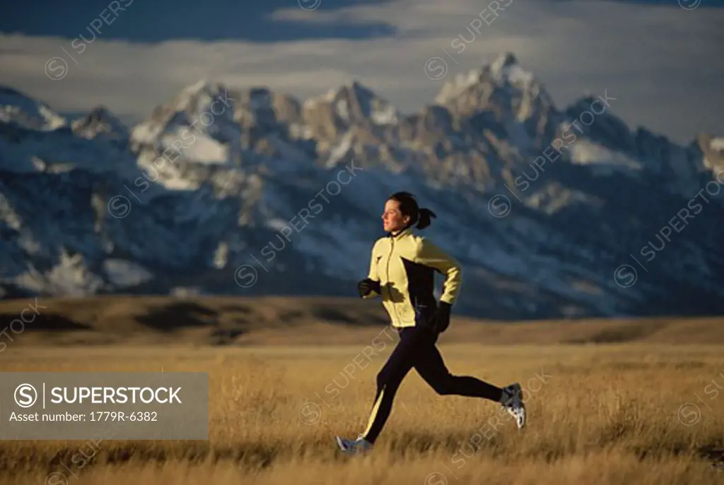 Woman running in remote field