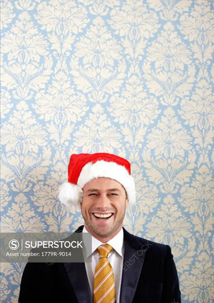 Smiling man in Santa hat