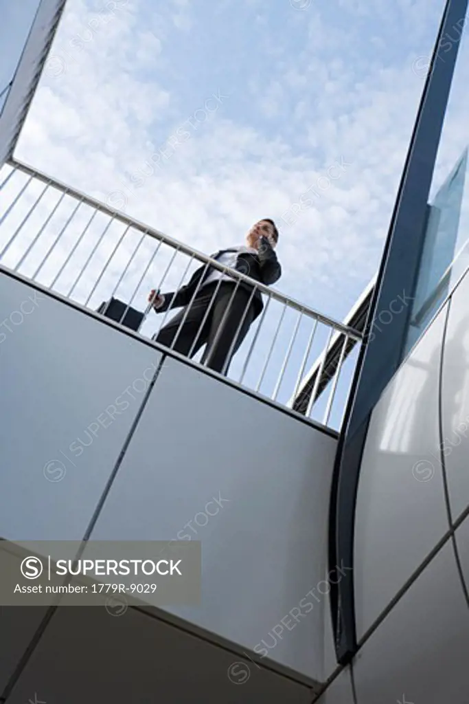 Low angle view of businesswoman on balcony