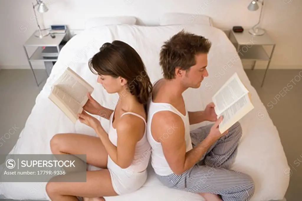 Couple reading books together