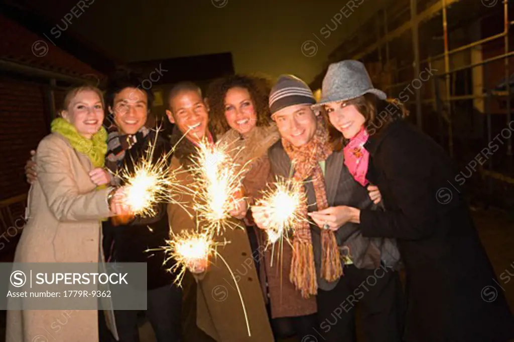 Friends holding sparklers