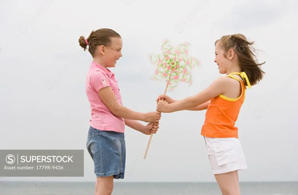 Young girls holding pinwheel