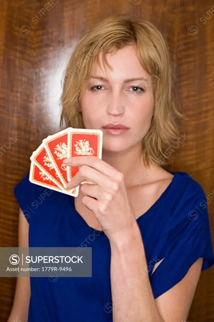Woman holding playing cards