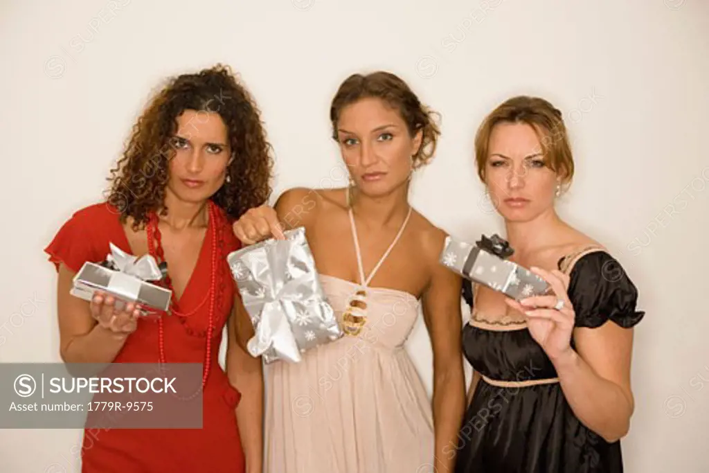 Women holding Christmas gifts