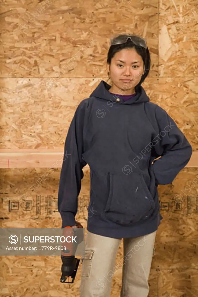 Teenage girl holding jigsaw