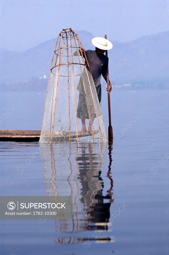Intha fisherman with net, Inle Lake, Burma
