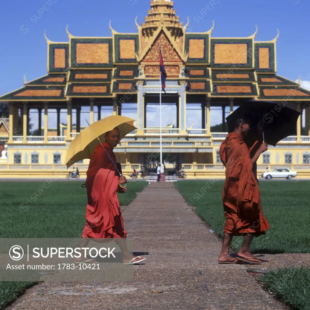Buddhist monks walking Royal Palace entrance, Phnom Penh,Cambodia.
