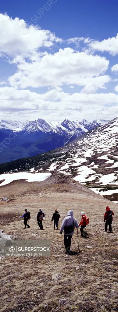 Tourists hiking in the Rockies, Alberta, Canada