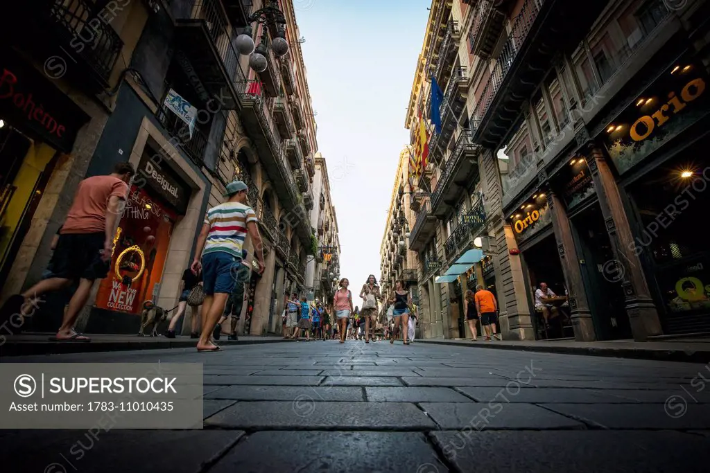 Pedestrians on the narrow street; Barcelona, Catalonia, Spain