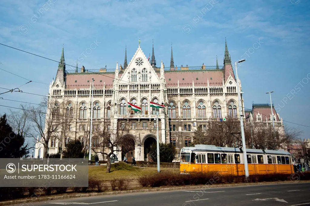 Tram Passing In Frony Of Hungary's Parliament, Budapest, Hungary