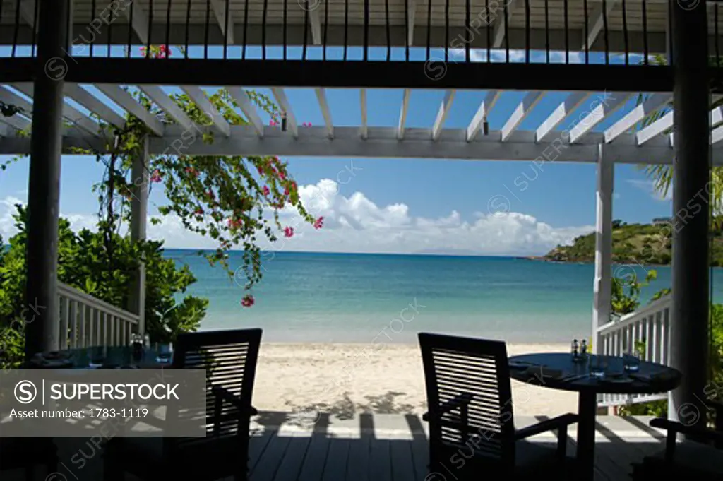 Tables on patio of beach hotel, Antigua.