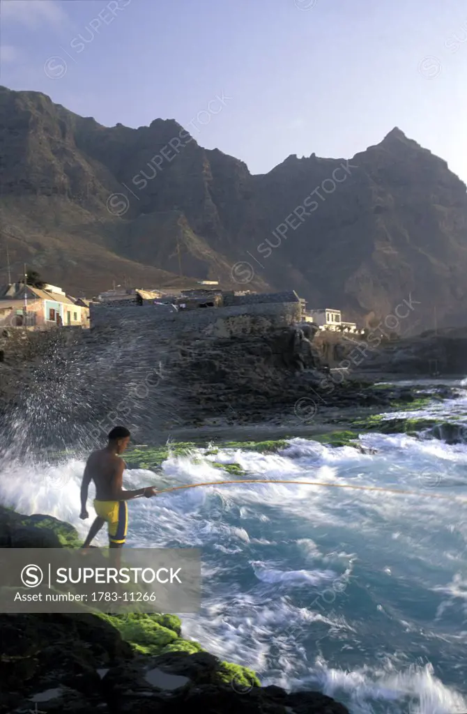 Young man fishing at Ponta Do Sol, Santo Antao, Cape Verde.