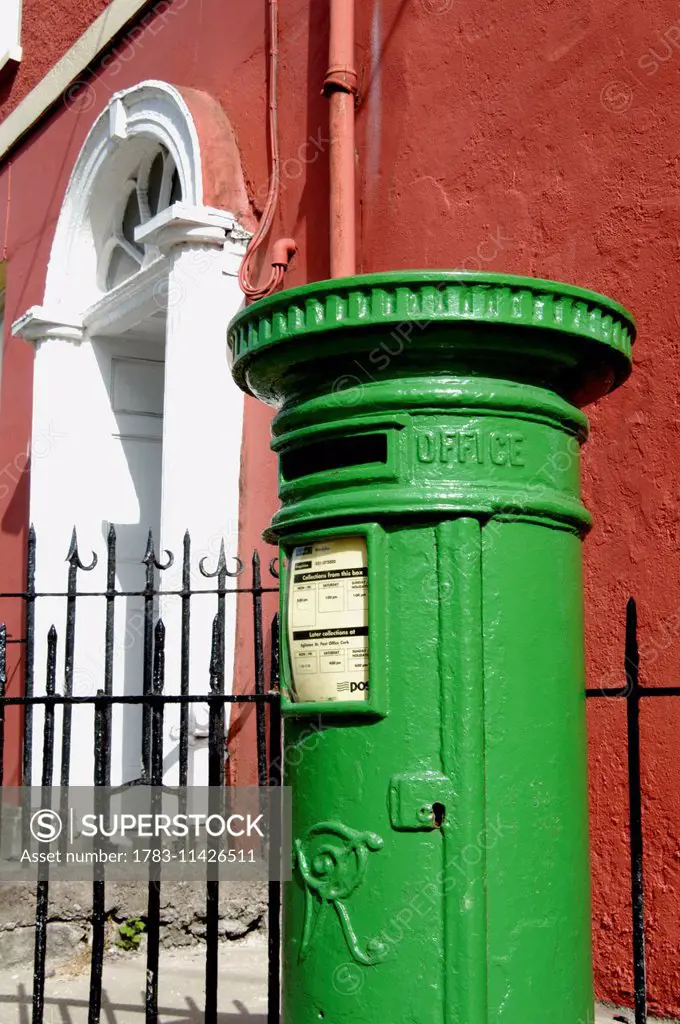 Cork, Ireland, European Capital Of Culture 2005. Green Irish Postbox In Front Of Red Georgian House, Sheare Street. Copyright