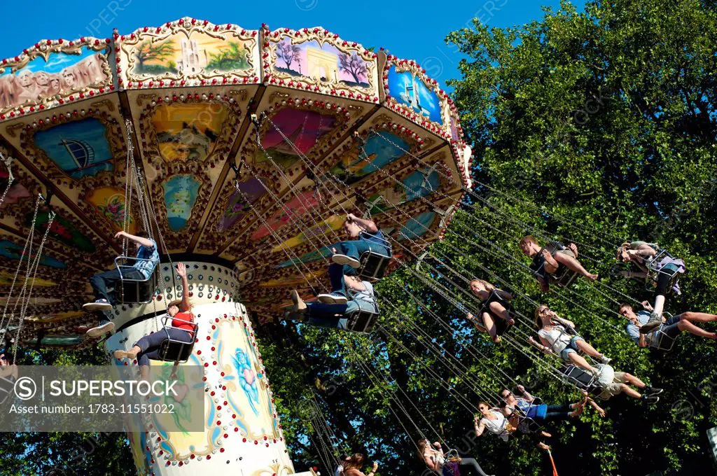 Festival Goers Having A Ride On A Waveswinger At Lovebox Festival In Victoria Park, London, Uk