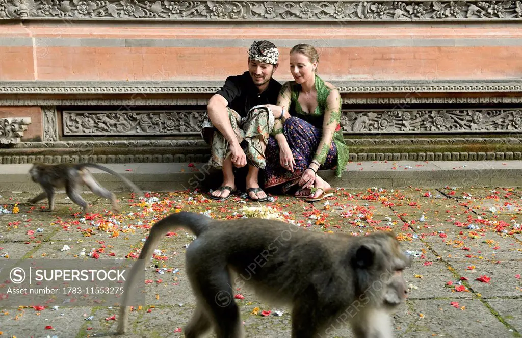Tourist couple at Monkey temple; Bali, Indonesia