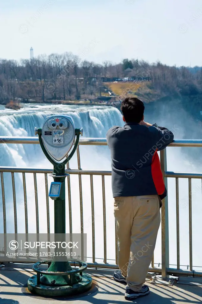 Tourists Enjoying The View Of Niagara Falls, Ontario And New York Border, Canada And United States Of America