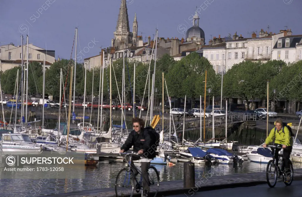 cycling along harbour front Charente-mar    , la Rochelle, France.