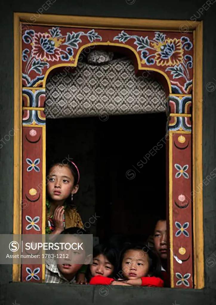 Bhutanese children in a window, Thimpu , Bhutan
