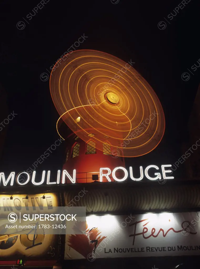 Low angle exterior view of Moulin Rouge, Paris, France.