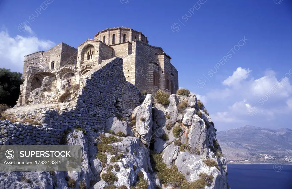 The Church of Ayia Sophia on stone cliff by coast, Monemvasia, Peloponnese, Greece