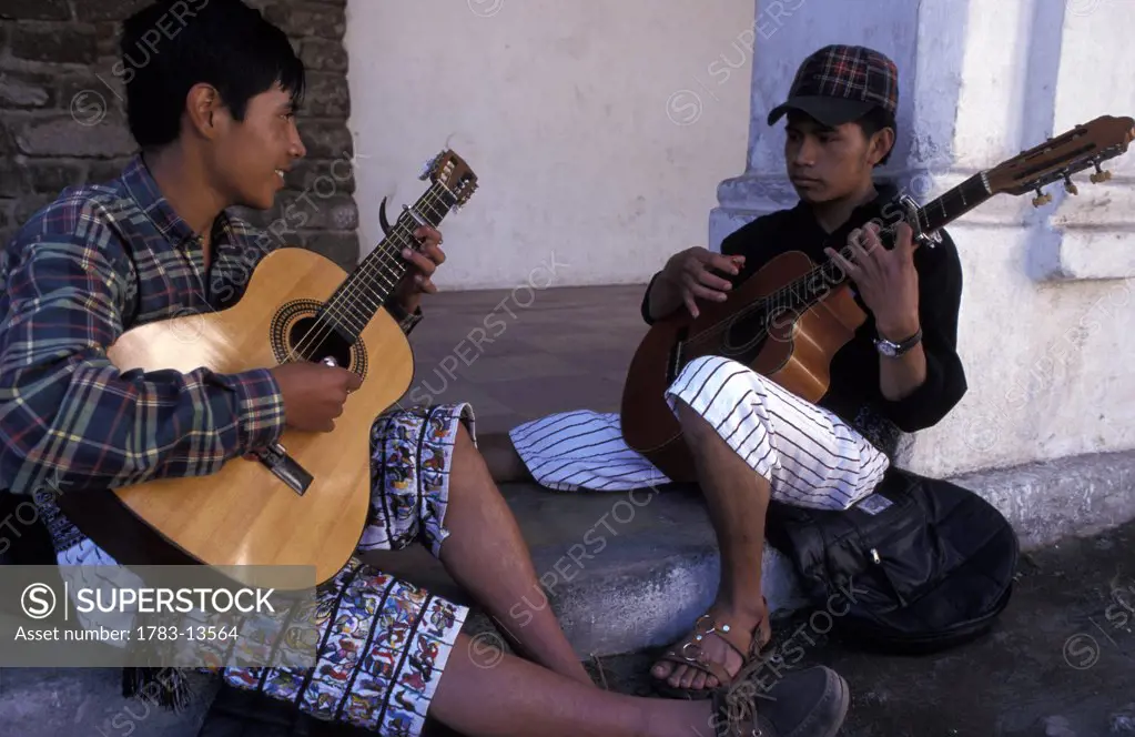 Boys playing guitars  , Lake Atitlan, Western Highlands, Guatemala.