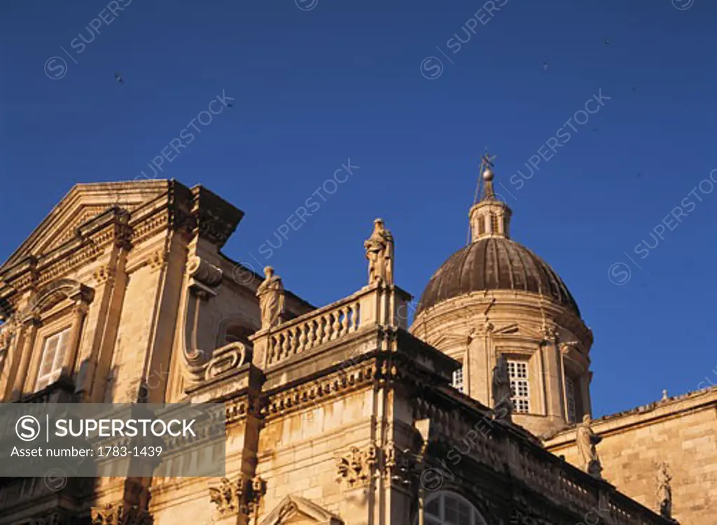 Swallows above the main cathedral at dusk in Dubrovnik, Croatia. 