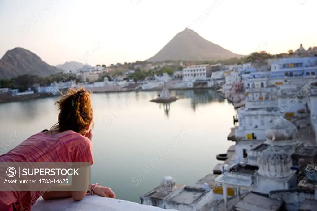 Woman admiring view of Pushkar, Pushkar, Rajasthan, India