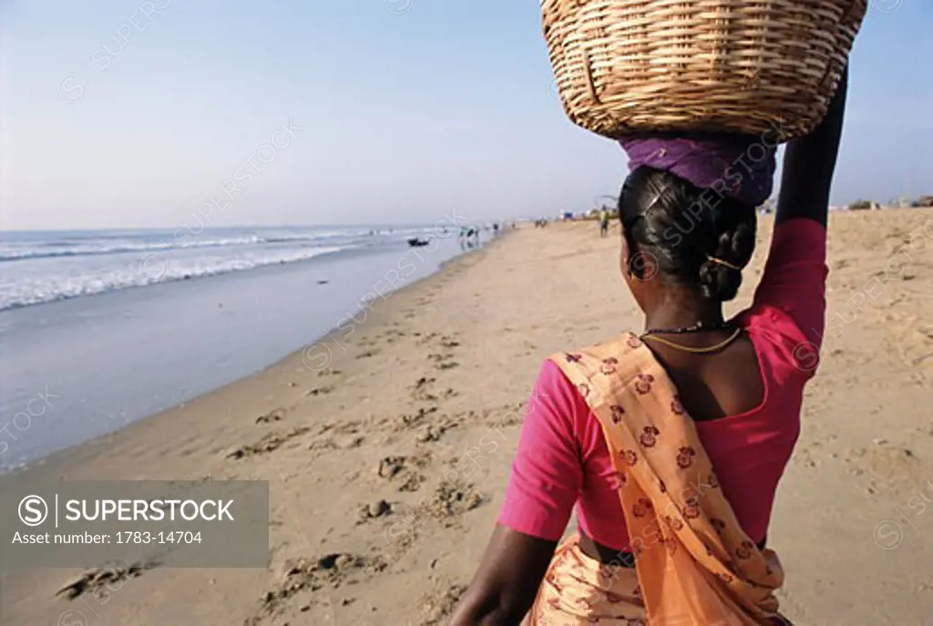 Woman on beach, Chennai, India