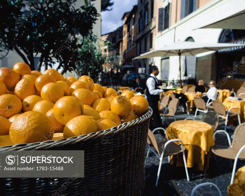 Cafe with oranges in Piazza Santa Maria, Trastevere, Rome, Italy