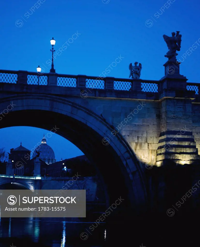 Ponte Sant Angelo and St Peter's Basilica at dusk, Rome, Italy