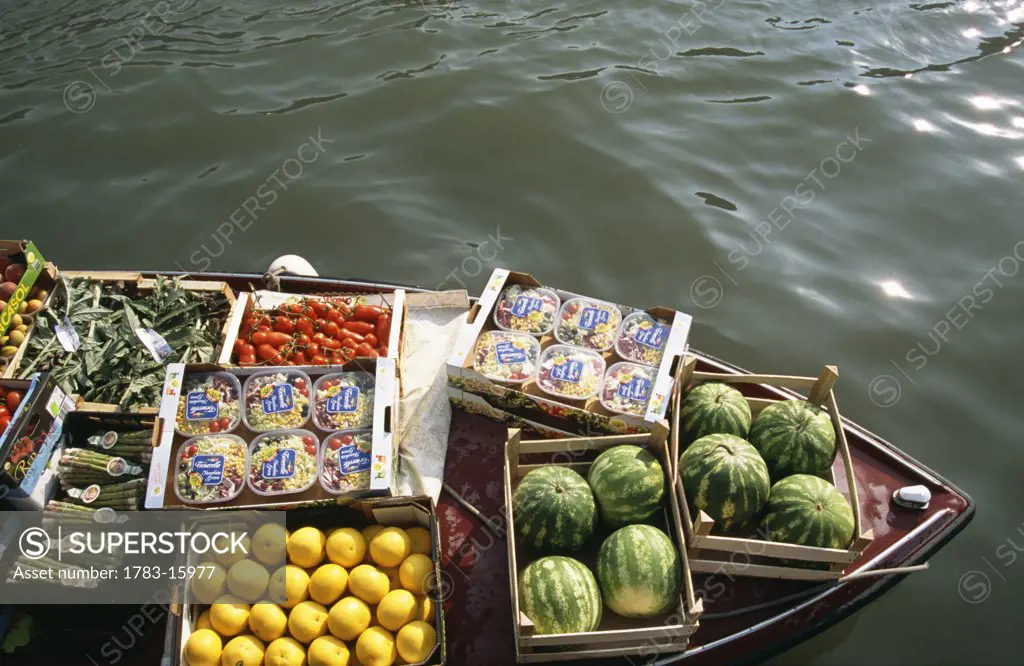 Fruit and vegetables on barge by Rialto food market on Grand Canal, Venice, Italy