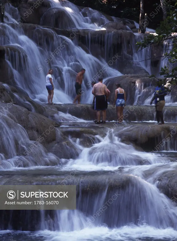 People climbing up Dunns River Falls, Ocho Rios, Jamaica.