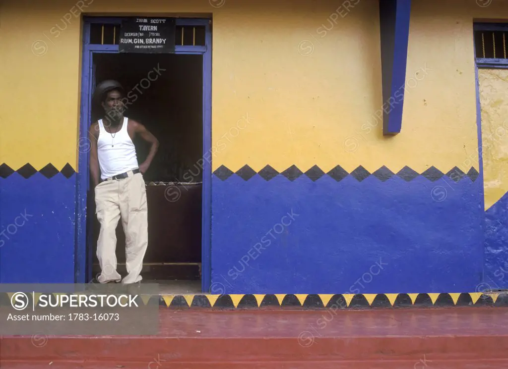 Rastafarian in doorway of bar, Porus Manchester, Jamaica.