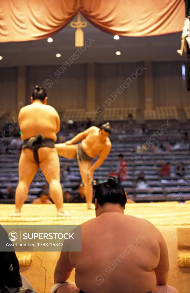 Sumo wrestler sitting prior to his fight at one of the six major tournaments, Fukuoka, Kyushu, Japan.