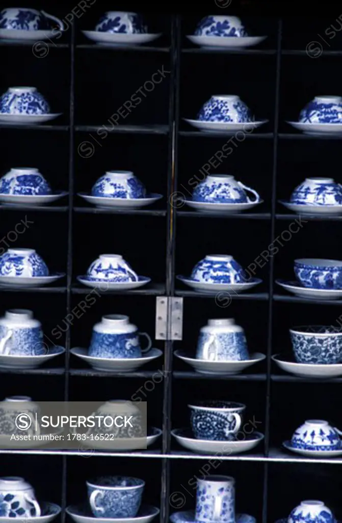 Porcelain tea sets in display cabinet, Japan.