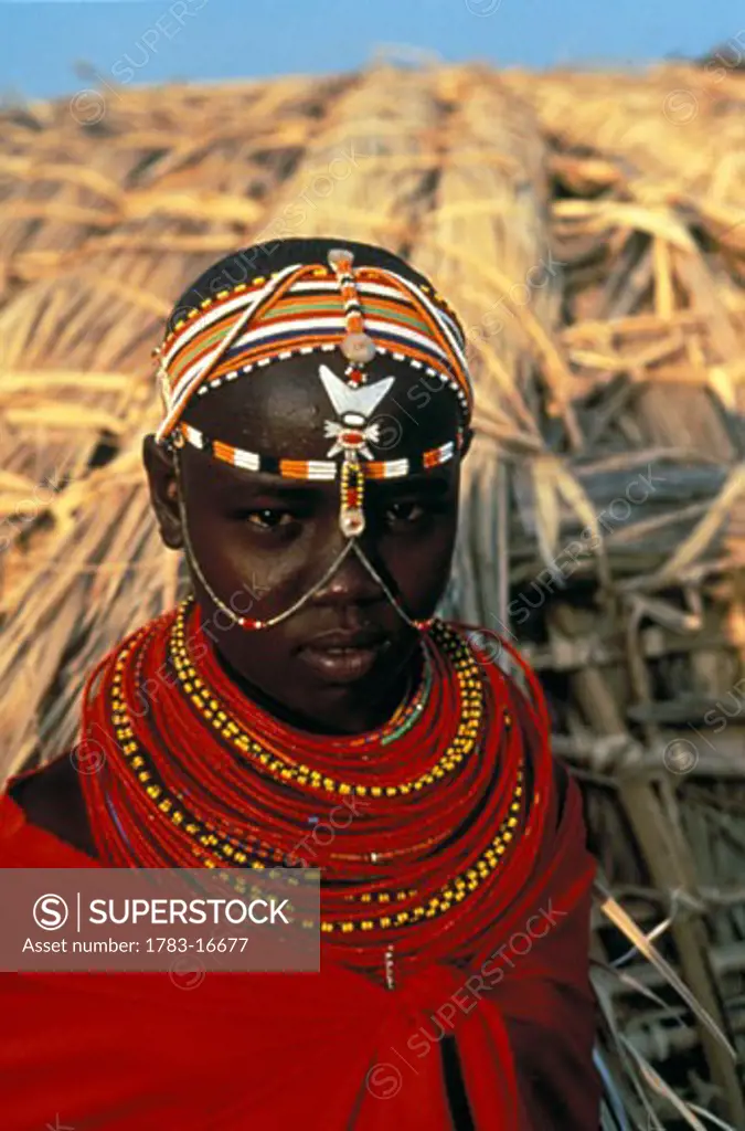 Close-up of Samburu girl with head and neck decorations, Ol Mayo, Kenya  .