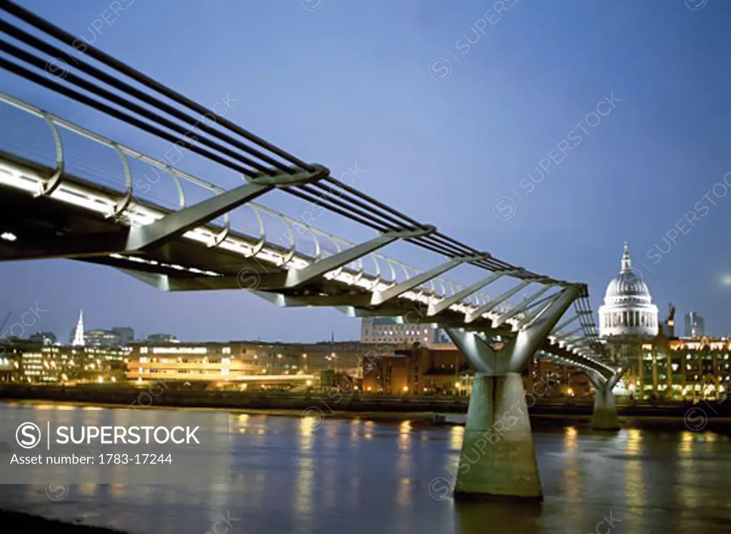 Millenium Bridge at dusk and St. Paul's Cathedral, London, England